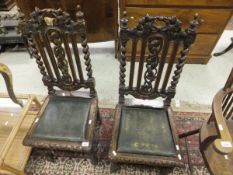 A pair of 19th Century oak framed hall chairs in the Carolean manner,