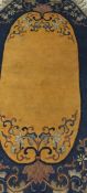 A Chinese rug of oval form,