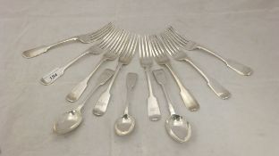 A collection of eight silver "Fiddle" pattern forks and three spoons,