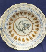 A 19th Century polychrome decorated Delft ware pedestal bowl of large proportions painted with a