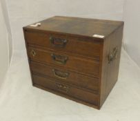 A circa 1900 oak table top chest of four drawers,