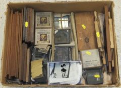 A box containing various magic lantern slides