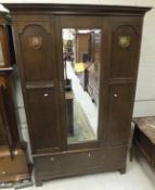 An oak single mirror door wardrobe with drawer,