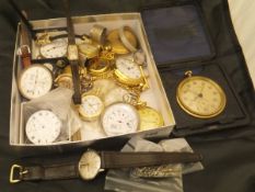 A box containing various pocket and wristwatches