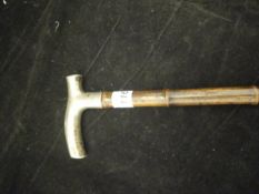 A Victorian silver-handled bamboo walking cane