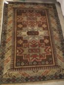 A Turkish rug, the three central medallions in cream, pale blue, mushroom and salmon,