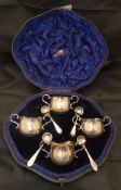 A cased set of four silver twin-handled open salts / mustards,