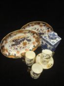A pair of 19th Century porcelain oval shallow serving dishes decorated in the Imari palette,