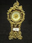 A circa 1900 gilt brass and simulated tortoiseshell mounted cased mantel clock by The British