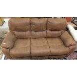 A modern three seater sofa with brown leather upholstery,