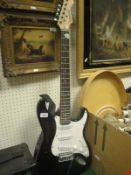 An Elevation Stratocaster Copy electric guitar, together with a Stagg 10 GA practice amp,