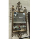 A rectangular wall mirror in the 19th Century manner with bevel edged plated and urn,