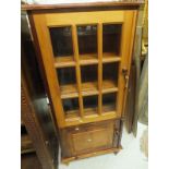A South African stink wood and yellow wood bespoke tv cabinet with tambour front over two doors and