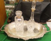 A cut glass whisky decanter with silver mounted neck,