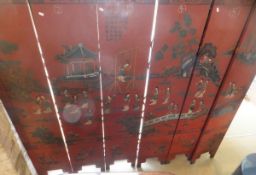 A six panel Chinese screen on a chinoiserie decorated red ground with various figures in
