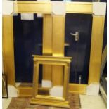 A pair of modern gilt picture or mirror frames and a Regency style carved and gilded frame