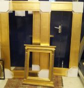 A pair of modern gilt picture or mirror frames and a Regency style carved and gilded frame