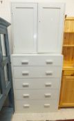 A modern pine dresser with two open shelves above three drawers and three cupboard doors,