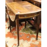 A 19th Century oval mahogany Pembroke table with satinwood inlay,