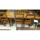 A late 20th Century mahogany drop-leaf rectangular dining table and a set of six ladder back dining