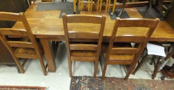 A late 20th Century mahogany drop-leaf rectangular dining table and a set of six ladder back dining