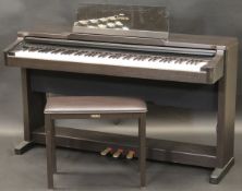 A Yamaha Clavinova CLP-124 and a Yamaha stool