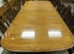 A good quality reproduction mahogany and cross-banded rounded rectangular twin pillar dining table