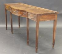 A George III mahogany breakfront serving table in the Adam taste, with applied harebell,