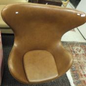 A modern Scandinavian style "egg" chair in the manner of Arne Jacobsen,