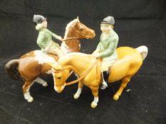 A Beswick pottery figure of a girl riding pony,