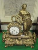 A 19th Century French gilt brass cased mantel clock decorated with Sappho with lyre and wreath,