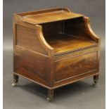 An 18th Century mahogany commode with three quarter galleried lift up top above lift top seat,