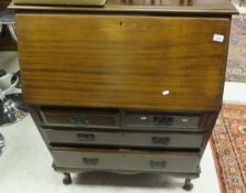 A 20th Century mahogany three drawer bureau on cabriole legs,