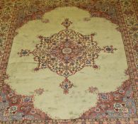 A Turkish carpet, the central floral decoration medallion in cream, pink, green and blue,