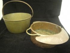 A 17th Century brass saucepan with swing handle,