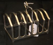 A silver toast rack (Chester, 1929), 4.