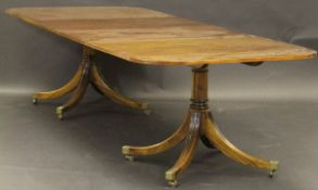 A William Tillman reproduction Regency style mahogany D-end extending dining table with two