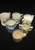 A box containing a collection of 19th Century pottery twin-handled mugs and tankards of large