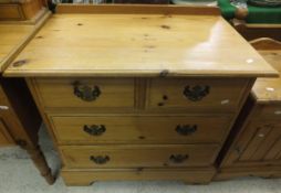 A pine chest of two short and two long drawers, two pine bedside cupboards,