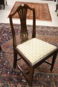 A set of six Hepplewhite style mahogany framed dining chairs with arching top rail,