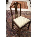 A set of six Hepplewhite style mahogany framed dining chairs with arching top rail,
