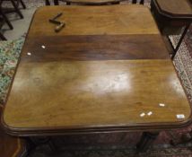 A Victorian mahogany rounded rectangular extending dining table on turned and reeded tapering legs