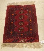 A Bokhara rug, the four central elephant foot medallions in burgundy,