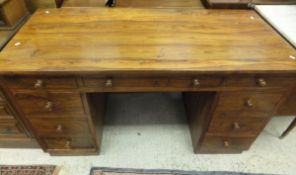 A modern Eastern hardwood pedestal desk,