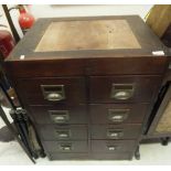 A mahogany banker's type chest of eight drawers with brass lug handles,