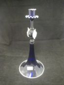 A Venetian style Bristol Blue glass candlestick with white glass borders and decoration