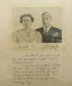 George VI and Elizabeth Silver Wedding interest - A framed and glazed photographic portrait of the