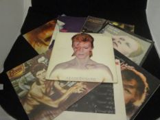 A collection of David Bowie LP records including "Aladdin Sane" (gatefold), "Space Oddity",