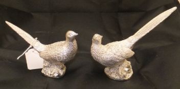 A small pair of silver covered pheasant ornaments (William Asprey & Son, London,