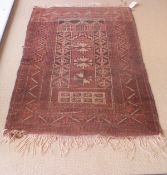 A Caucasian prayer rug, the centre field in cinnamon,